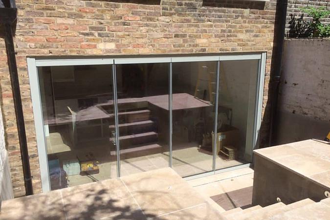 A further larger four panel set of bifolds to the downstairs living space