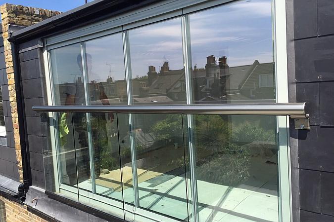 Our four pane doors behind glass balustrade