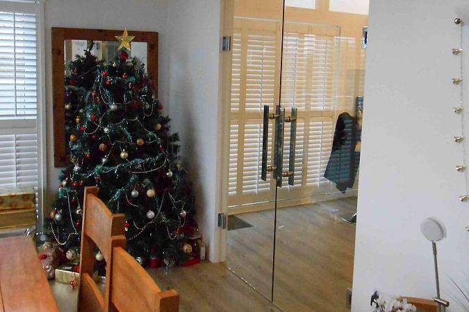 We can even provide a room divider to smaller openings with double frameless glass doors